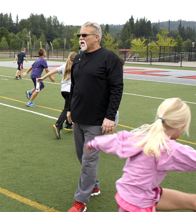 Mount Si head coach Charlie Kinnune leads a group of elementary-age athletes at summer speed camps Wednesday