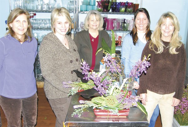 Designers at Down to Earth Flowers and Gifts offer individual customer service that you don’t get from a website. Pictured from left are Juliana Blanks