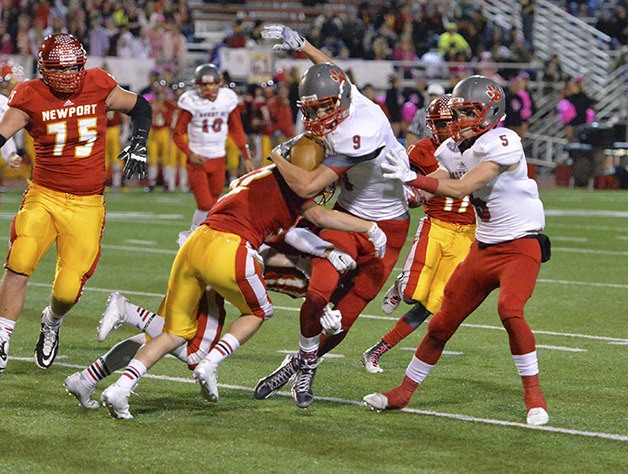 Mount Si’s Parker Dumas jukes his way through the Newport defense early Friday night