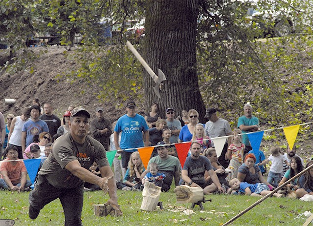 David Moses demonstrating the axe throwing event at Railroad Days 2014.