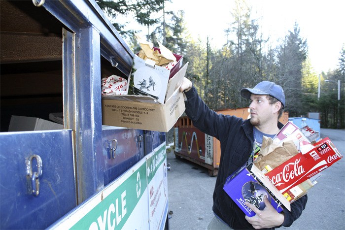 North Bend resident Brian Mauhl drops off a load of cardboard at the Cedar Falls transfer station’s public recycling bins. Mauhl uses the facility roughly once per month