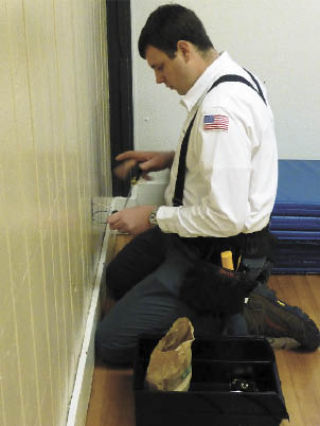 Electrician Ben Bullerwell of Accurate Electric installs new tamper-proof outlets at Si View Community Center. Accurate Electric did the service project this month to inspire more community efforts.