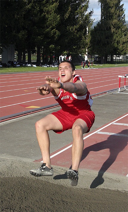 Mount Si’s Joe Farmer soars in the triple jump during competition against Interlake last Thursday
