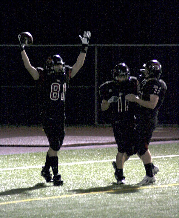 Cedarcrest’s Nick Gagner celebrates a successful interception and 76-yard carry to the end zone during play Thursday