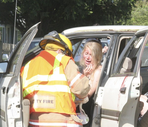 As Mount Si High School students look on