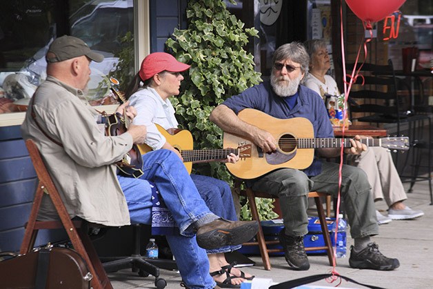 Down the Road plays blues on the Railroad Avenue sidewalk during a past year's Finally Friday Art Walk in Snoqualmie. The summer event returns Friday