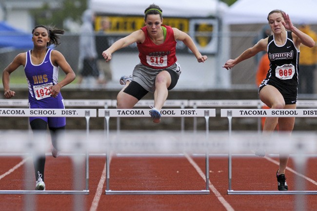Mount Si senior Hannah Hasbun clears a path in the 300-meter hurdles at state track finals last weekend. Hasbun took a champion’s medal in the event