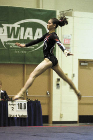 Mount Si junior Georgia Reynolds walks on air during her floor routine at state. She tied for fourth in the event. As a team