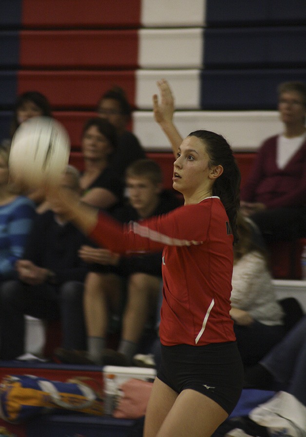 Anna McCreadie serves at districts last season. The senior wil co-captain the 2014 Wildcats.