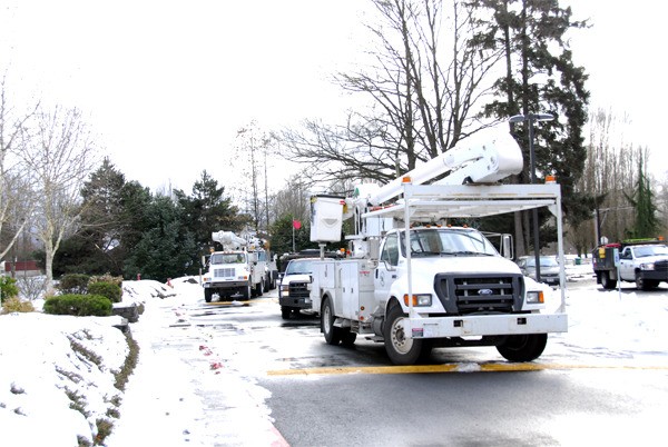 A fleet of electrical service trucks rolled into Carnation Saturday morning