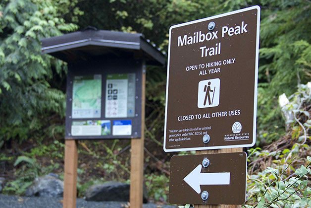 Signs mark the start of the new and improved Mailbox Peak trailhead