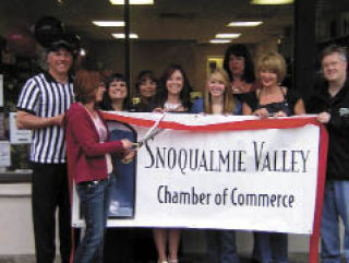Members of the Snoqualmie Valley Chamber of Commerce help staff at Rachel’s Hair Design mark their move to a new location