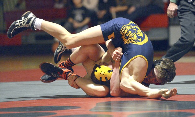 Gunnar Harrison wraps up Bellevue’s Garret Williams in their match on January 10. With some league challenges approaching