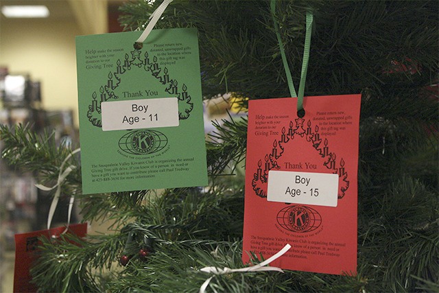 Giving Tree tags list the gender and age of a child  for whom donors can buy gifts.