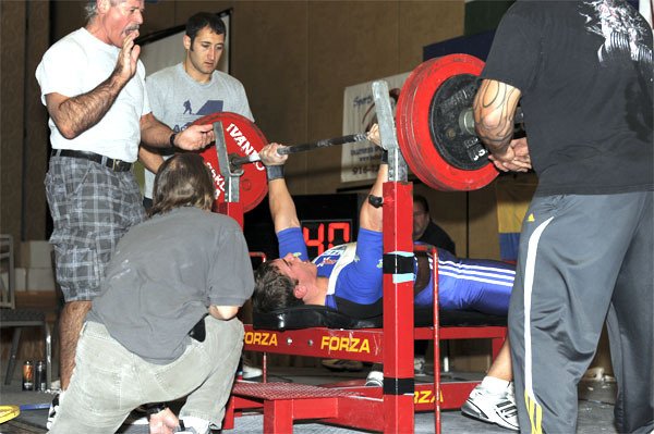 North Bend’s Doc Derwin hoists a massive barbell during his world-record-setting benchpress performance in Las Vegas. Derwin lifted 429 pounds to claim the title.