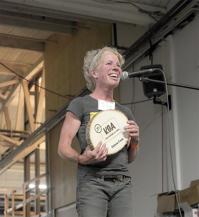Oxbow Farm Children’s Program Manager Sarah Cassidy accepts an award from the Kids’ Outside Alliance.