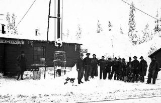A group of railway workers pose at the Laconia station in this photgraph