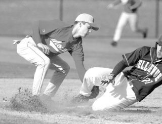 Mount Si’s Danny Cavanaugh makes a tag at third base against a Bellevue runner