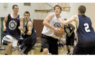 Mount Si’s Lucas Zupan drives for a basket during their summer league game last Thursday night