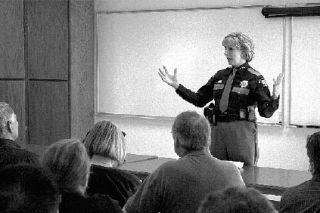 King County Sheriff Sue Rahr spoke to more than 50 concerned community members at a meeting Monday night at the Fall City Fire Station. About $2.5 million is being cut from the sheriff’s office budget.