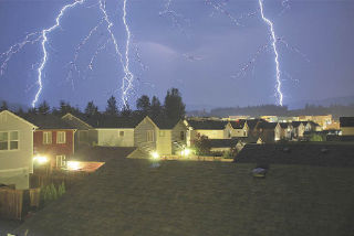 Lightning cascades around the Snoqualmie Ridge retail marketplace in this photo