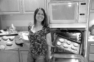 Donna Padilla of Wood River leads a team of “Baker Angels” who send home-made treats to wounded soldiers at Fort Lewis.