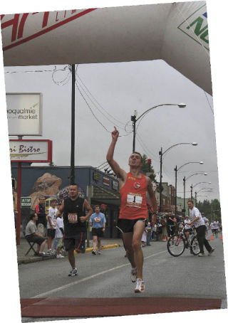 Raising a “1” sign in triumph