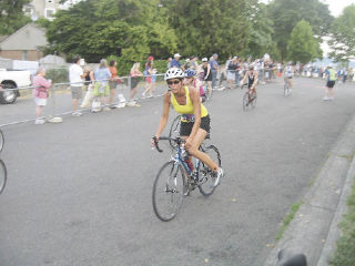 North Bend athlete Gina Volken comes into the transition area following the bike portion of the Danskin Women’s Triathlon