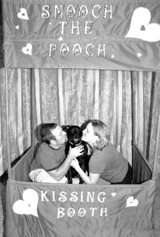 Ben and Cheryl Reed share a joint smooch with their dog Ginny