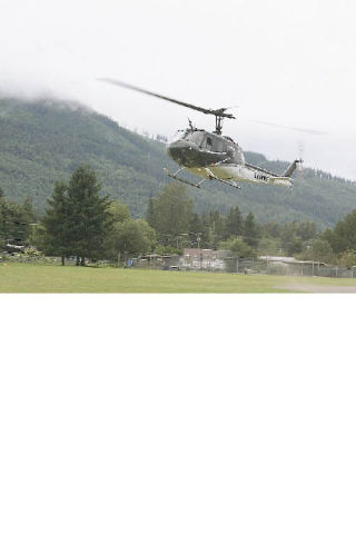 The King County Sheriff’s Guardian Two helicopter lands at Torguson Park in North Bend Thursday afternoon