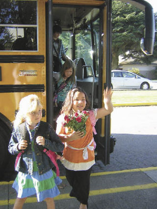 Anna Butyorak and Emma Halseth step off the bus at Fall City Elementary on the first day of school