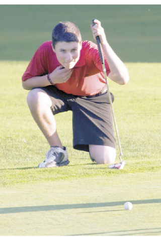 Wildcat golfer Jack Kelly eyes the green during play Monday