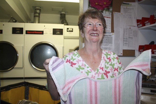 Folding one of the last towels she’ll handle as laundrywoman at Mount Si Transitional Center