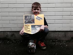 North Bend Elementary pupil Hunter Caple starts a coin drive for Oso victims.
