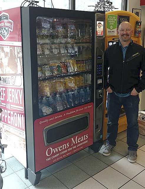 Owner Bryan Wyrsch poses with the Mount Si Shell Station’s new vending machine