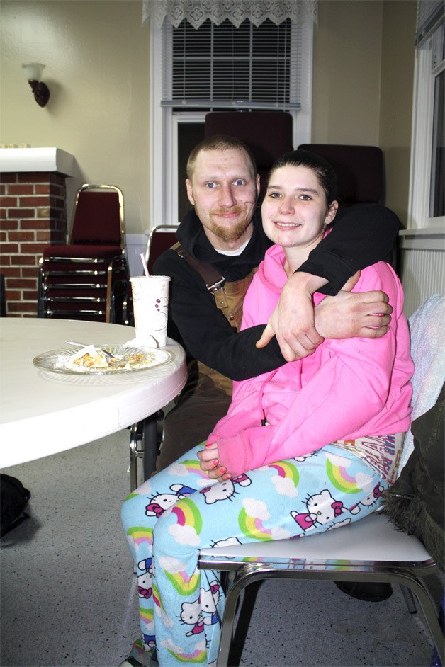 Jesse and Tiffany share a hug after dinner at the Snoqualmie Valley Winter Shelter. The couple comes to the shelter often for the hot meal
