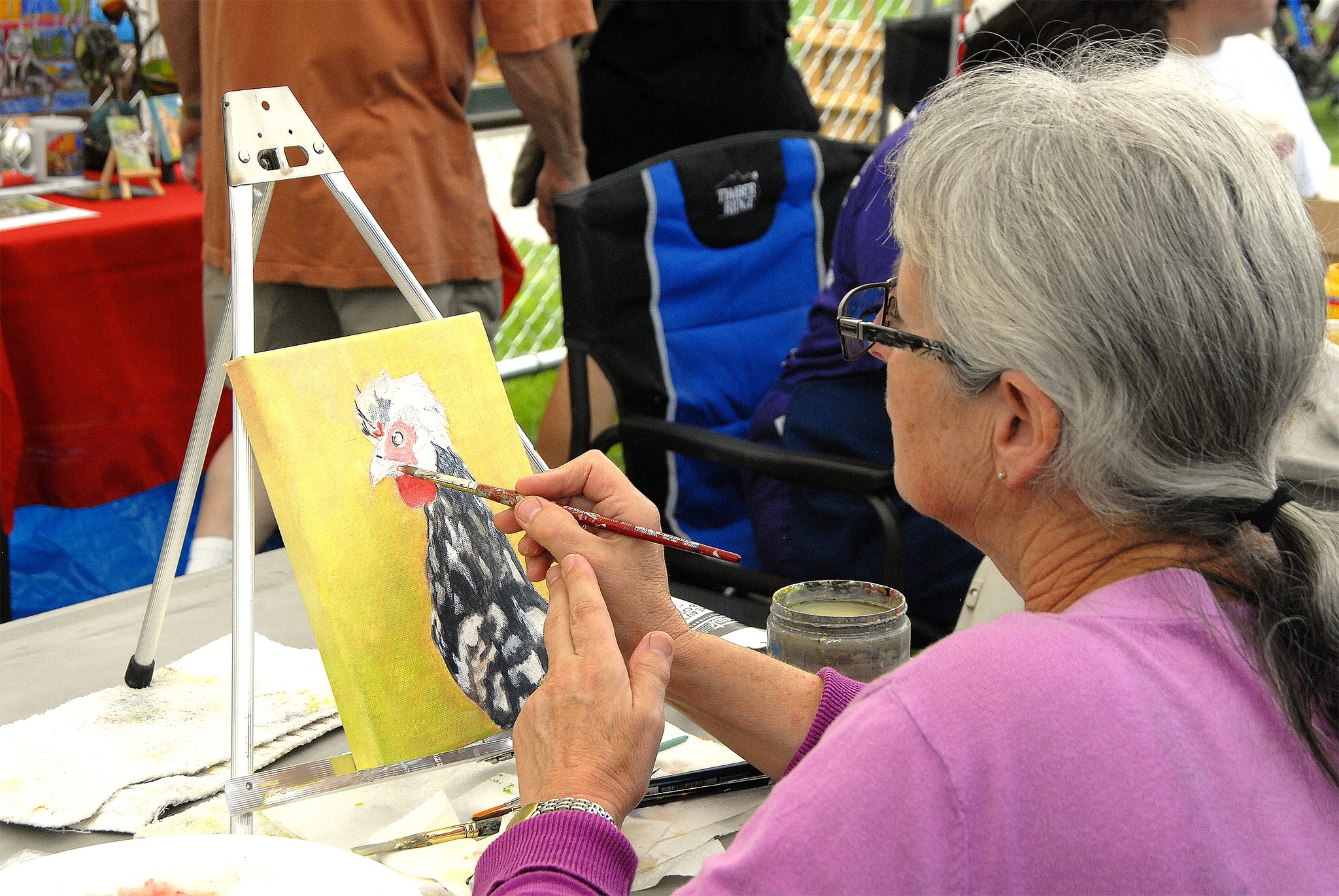File PhotoA rooster is painted on a small canvas at the 2015 artist showcase.