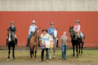 Showing off ribbons from their first horse show in Auburn are Mount Si Sidekicks 4H Club members Evanne Webster