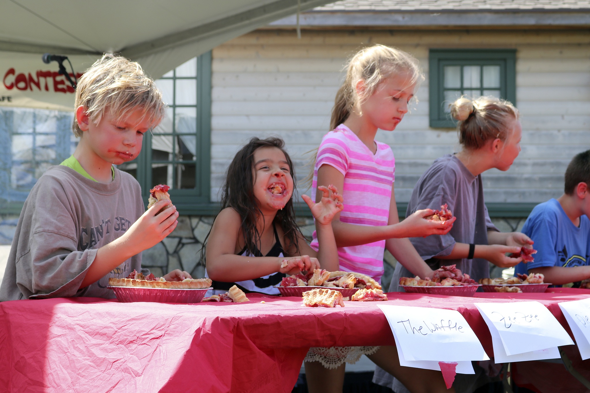 Zariya Jiwani breaks out in laughter at the Cherry Pie eating contest sponsored by Twede’s Cafe.