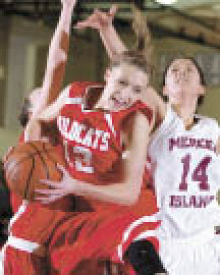 Wildcat forward Hailey Eddings pulls down a rebound at Mercer Island.