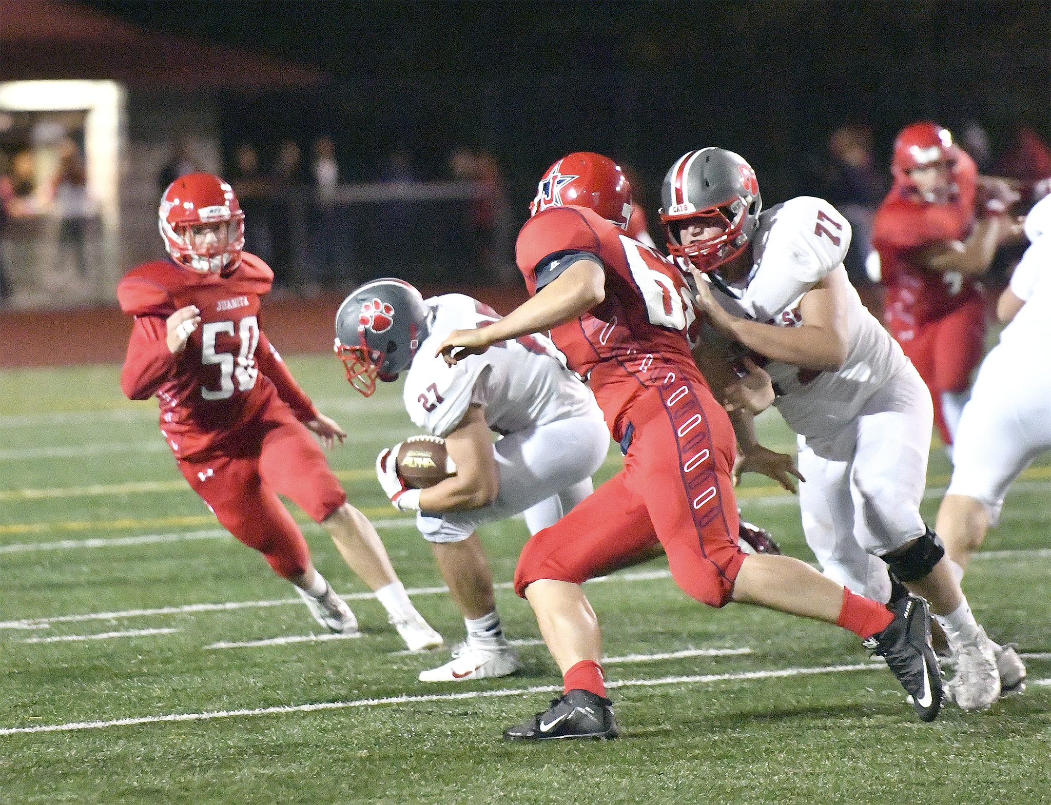 Photo Courtesy of Calder ProductionsWildcats No. 27 Jack Weidenbach weaves past a Juanita Rebel in the opening game of the season for Mount Si last Friday at Juanita. He was the leading rusher in the game