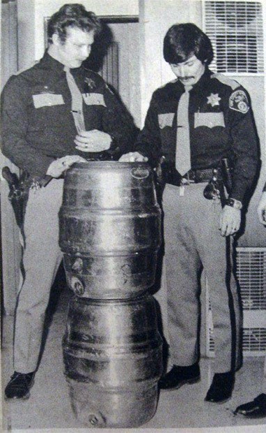 King County police officers are show with two kegs of beer