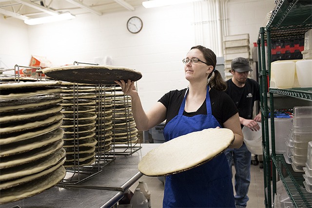 Frankie’s Pizza’s North Bend store manager Heidi Ayres preps for a busy Friday night on March 20.