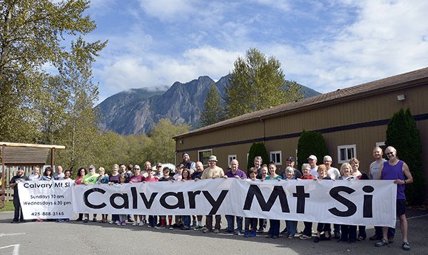 Calvary Chapel churchgoers promote the non-denominational church with a large banner.