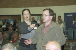 Northwest Railway Museum Executive Director Richard Anderson talks about the impact of flooding on museum-owned tracks during a packed-house town hall meeting hosted Wednesday