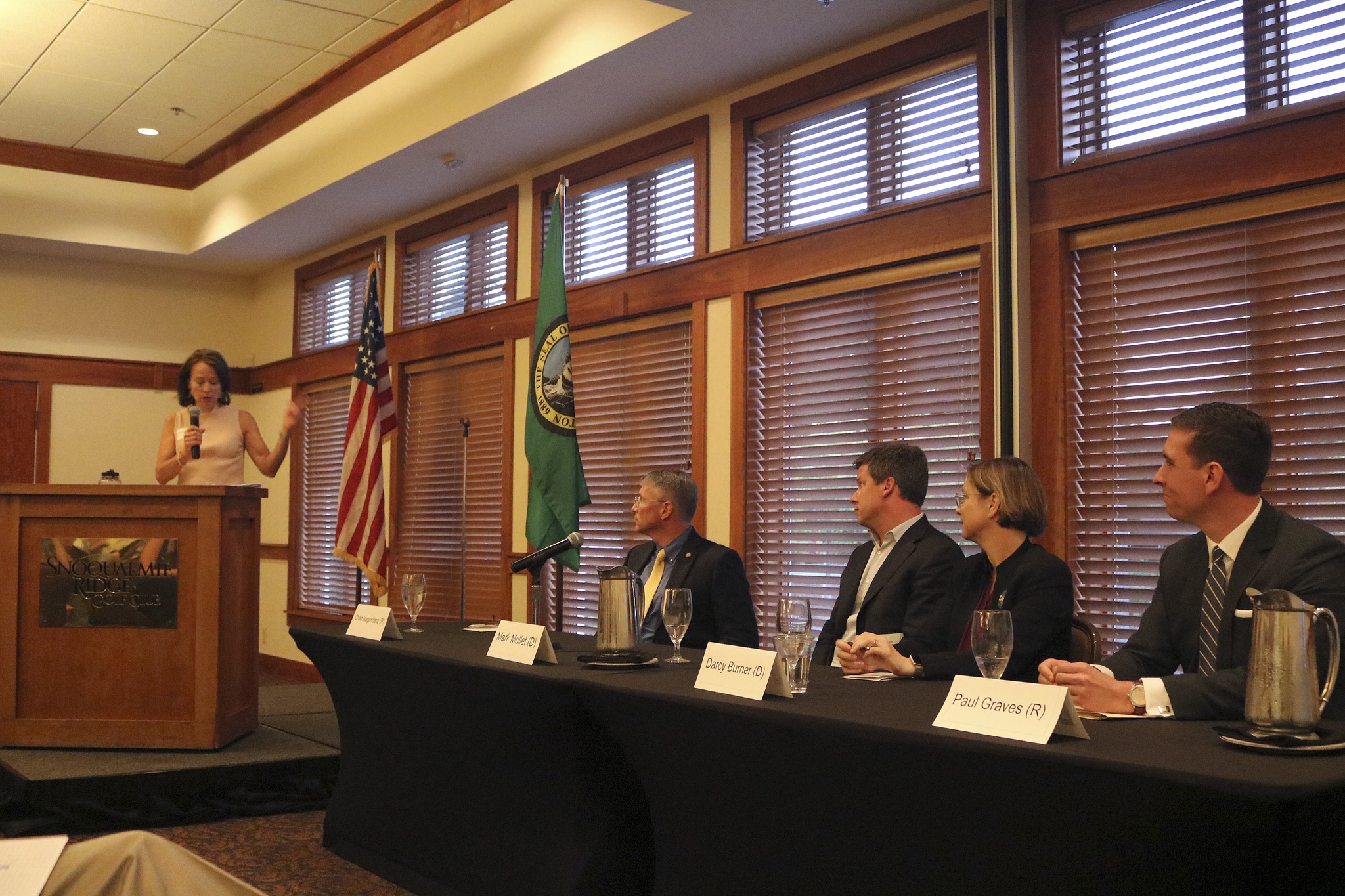 The panel of candidates listen to moderator Carolyn Simpson as she asks them a question about the Snoqualmie highway interchange during last Wednesday’s first Chamber of Commerce candidate forum. A second forum starts at noon Wednesday