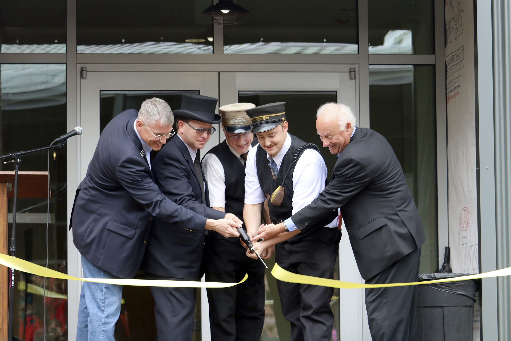 Evan Pappas/Staff PhotoOrganization representatives officially cut the ribbon on the Railway Education Center. From left