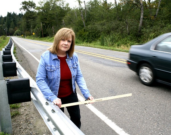 Measuring the shoulder strip along Highway 203
