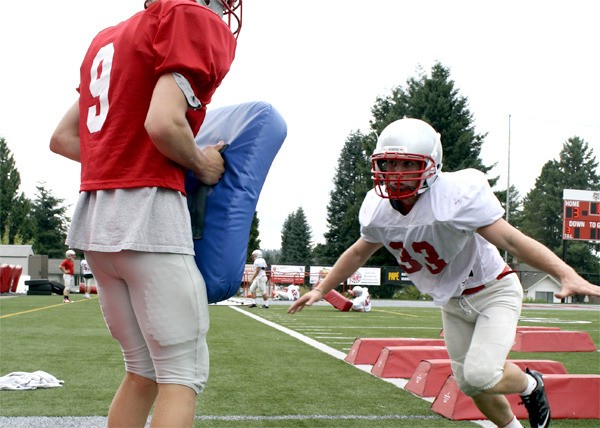 Senior Mount Si co-captain Connor Deutsch powers into a teammate during tackling drills. “We really want to work hard