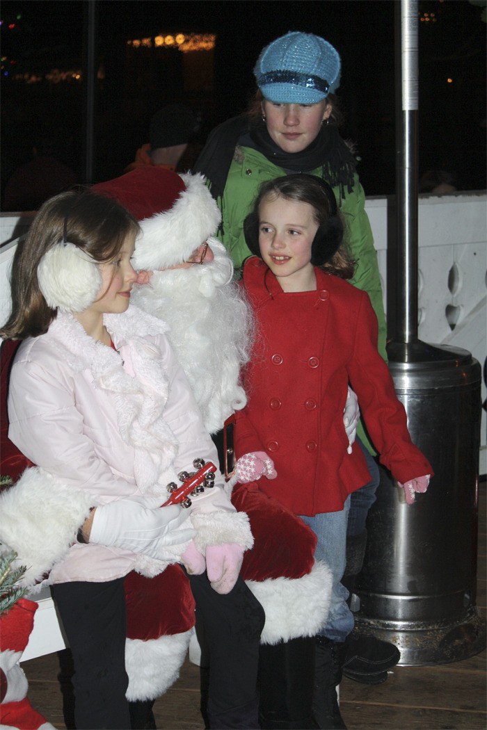 Families visit Santa Claus at the Snoqualmie tree lighting event